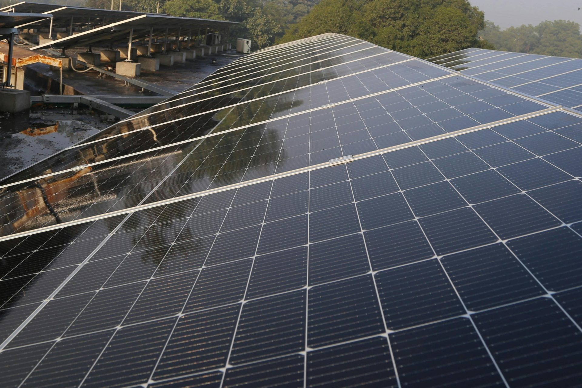 Wide view of solar panels on a rooftop in Lahore, promoting clean energy and sustainability.