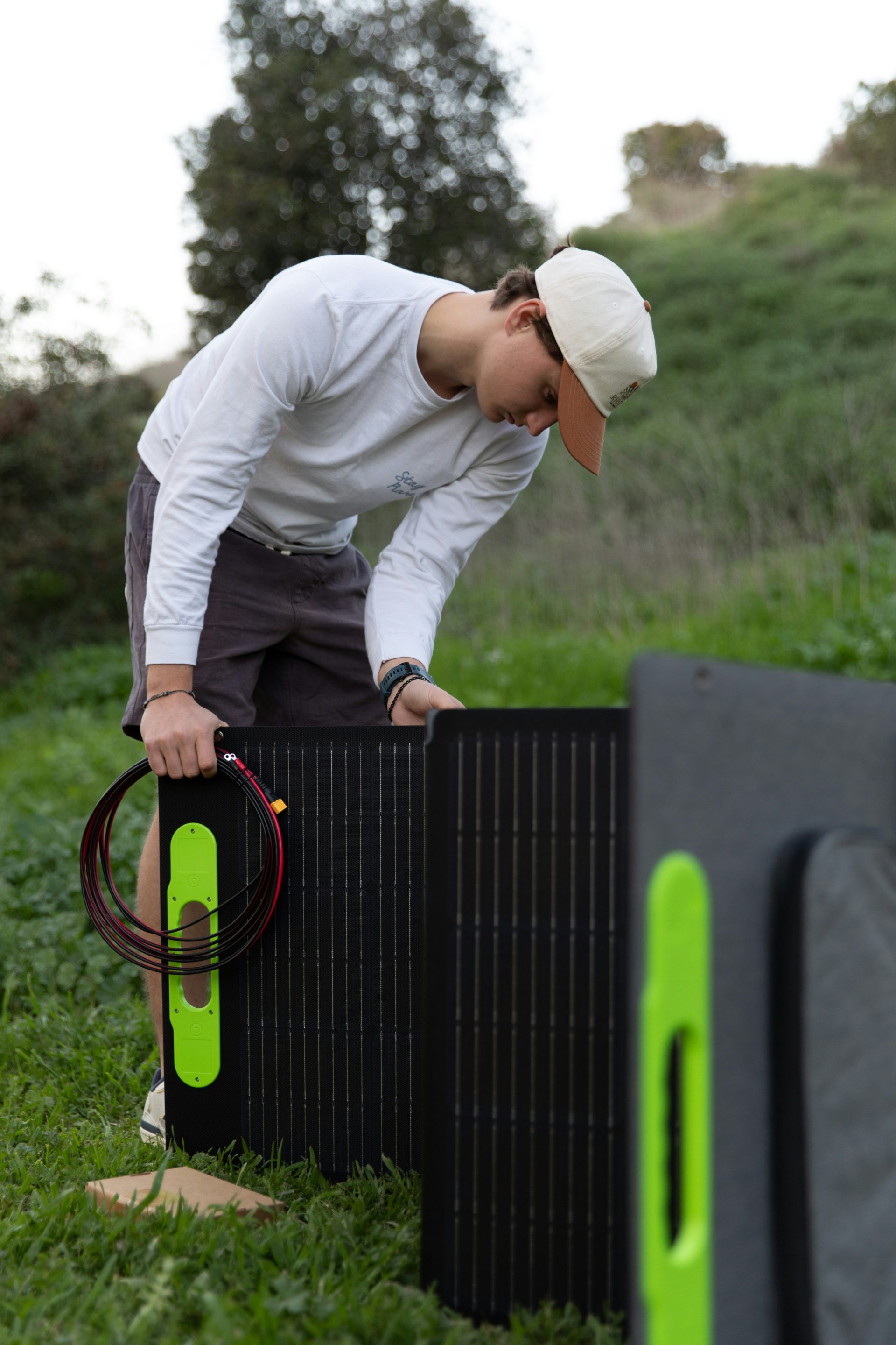 a man in a white shirt and a black and green box